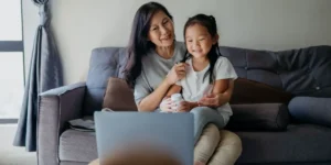 Parent and child attending an online psychiatry appointment