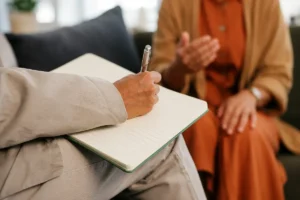 Clinician conducting an adult psychiatric evaluation
